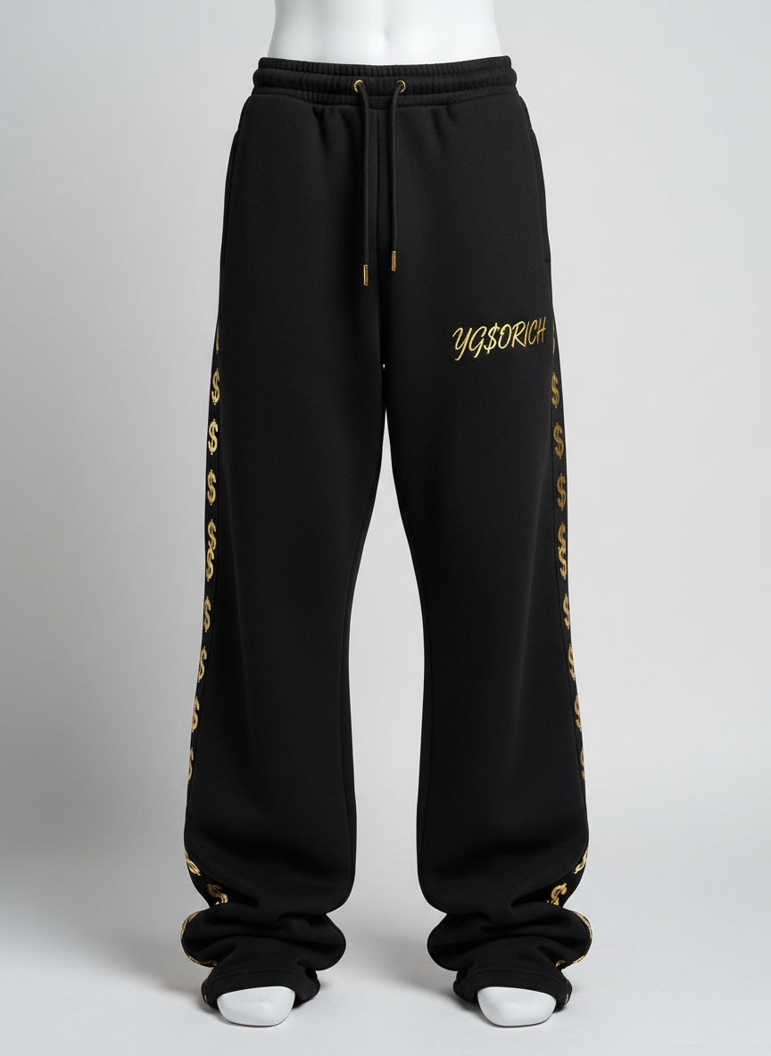 Baggy stacked black sweatpants with gold dollar-sign taping down the seams
