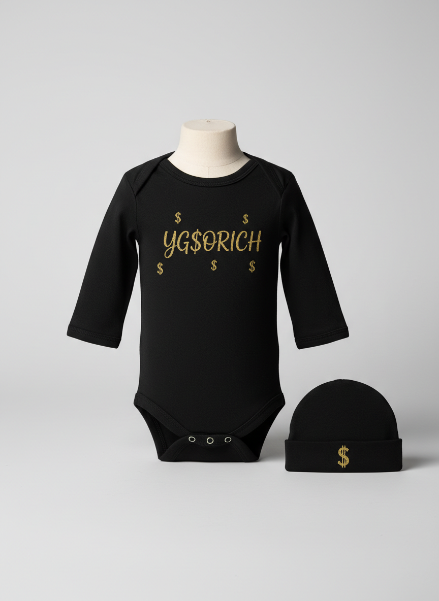 Black baby onesie with gold YG$ORICH and scattered dollar signs, with a matching beanie